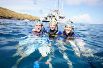 Bueatiful Family Swimming In The Sea